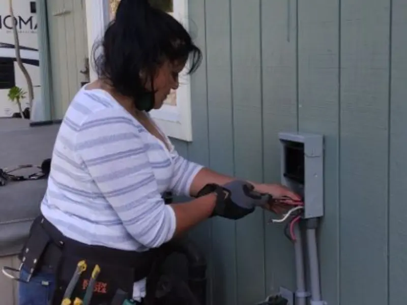 Licensed electrician wiring an exterior subpanel in Sebring